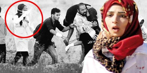 رزان النجار با لباس سفید پرستاری هدف گلوله تک تیرانداز اسراییلی قرار گرفت و به شهادت رسید.