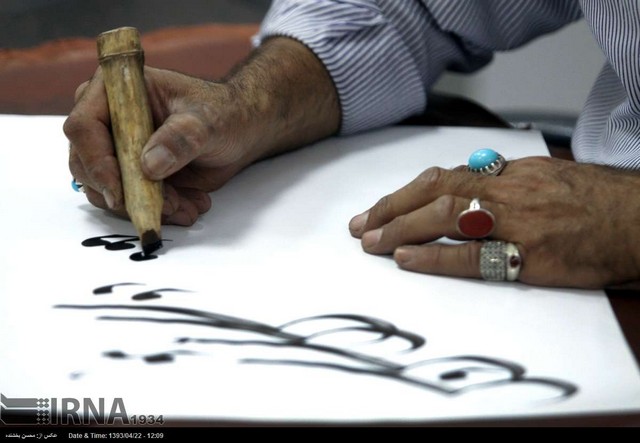 کتابت آیات قرآن کریم در مشهد (عکس)