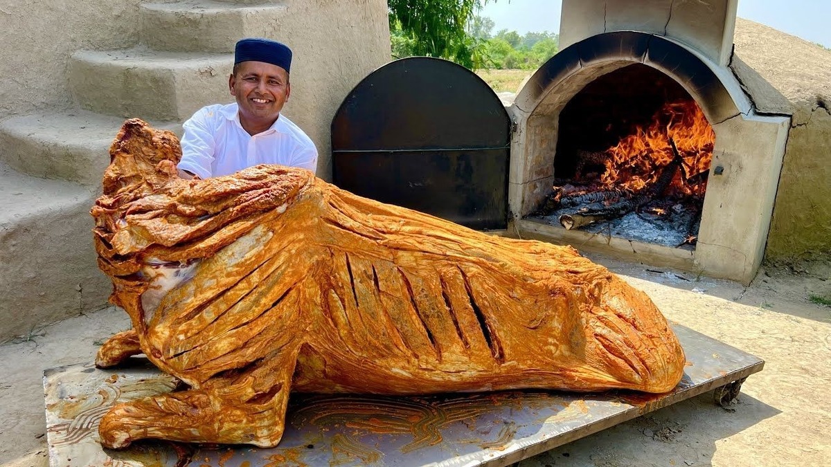مراحل پخت یک گاو ۲۰۰ کیلوگرمی در تنور به سبک آشپز مشهور پاکستانی (فیلم)