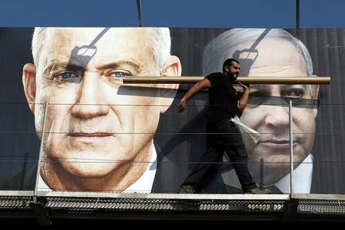 بنرهای تبلیغاتی رهبران اسراییل در آستانه انتخابات پارلمانی در شهر تل آویو/ رویترز